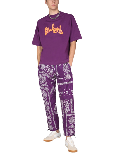 Shop Palm Angels Bandana Print Trousers In Purple