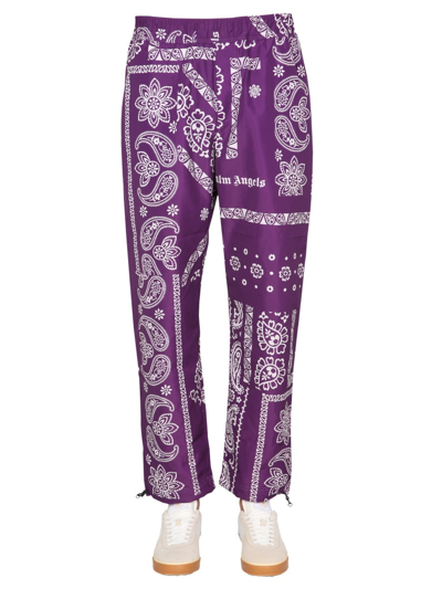 Shop Palm Angels Bandana Print Trousers In Purple