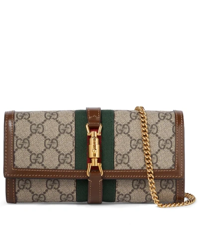 Shop Gucci Jackie 1961 Gg Supreme Clutch In Be.ebon/br.sugar/vrv