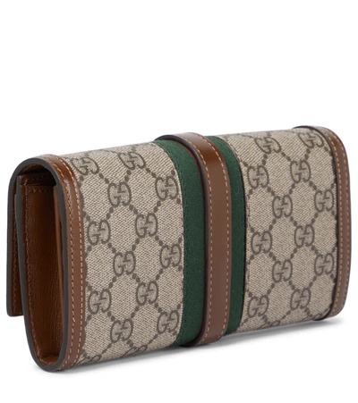 Shop Gucci Jackie 1961 Gg Supreme Clutch In Be.ebon/br.sugar/vrv