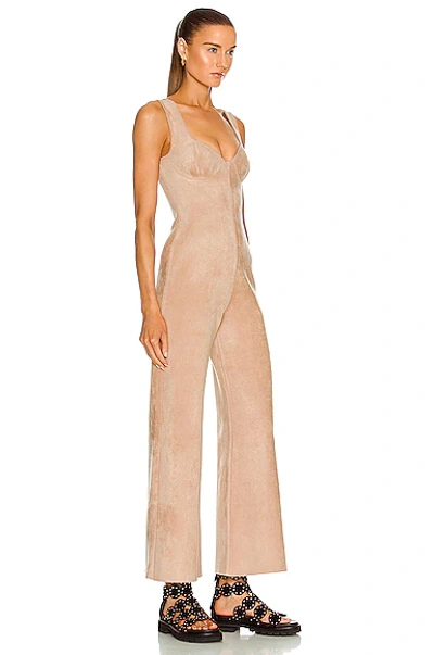 Shop Alaïa Sleeveless Bustier Jumpsuit In Nude