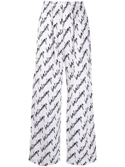 Shop Balenciaga Signature Logo-print Wide-leg Trousers In Weiss
