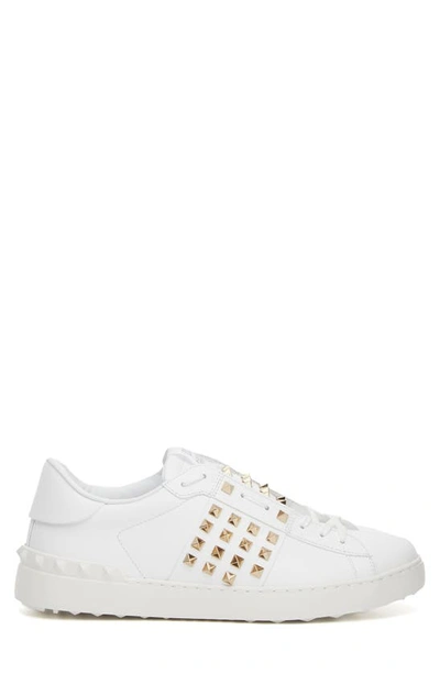 Shop Valentino Rockstud Open Sneaker In White/ Gold