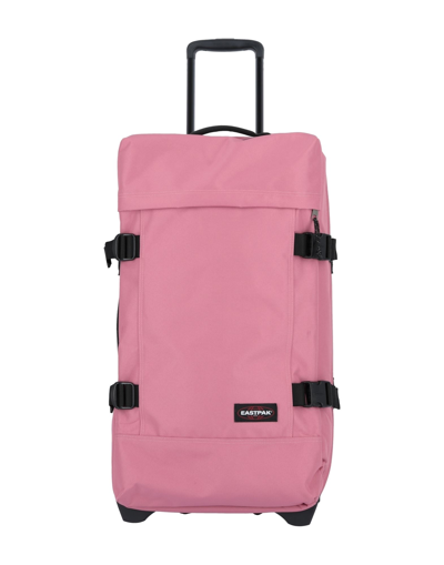 Shop Eastpak Wheeled Luggage In Pastel Pink