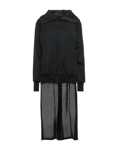 Shop Yohji Yamamoto Overcoats In Black
