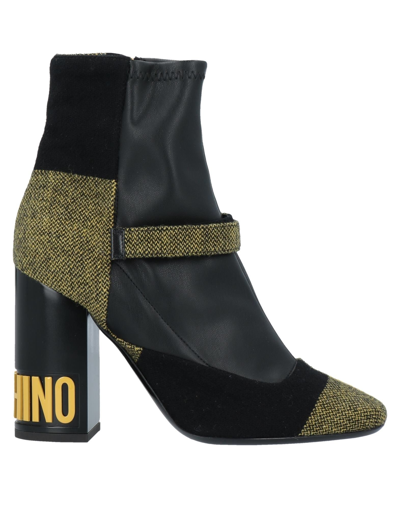 Shop Moschino Ankle Boots In Yellow