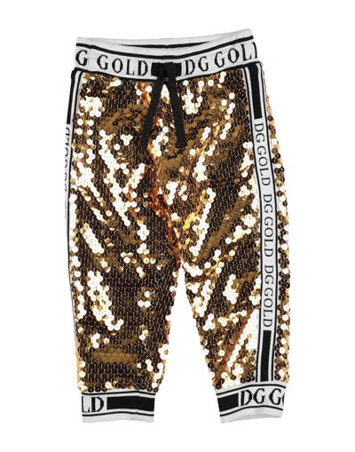 Shop Dolce & Gabbana Pants In Gold
