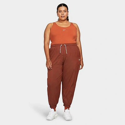 Shop Nike Women's Sportswear Essential Oversized Woven Mid-rise Jogger Pants (plus Size) In Burnt Sunrise/white