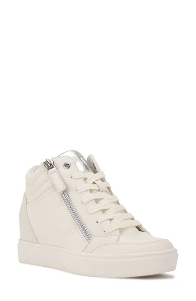 Shop Nine West Tons Lace-up Wedge Sneaker In White/ Silver