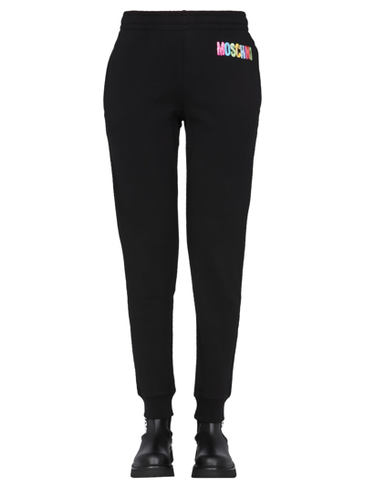 Shop Moschino Jogging Pants With Logo Print In Nero
