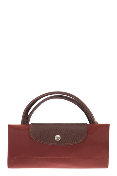 Shop Longchamp Le Pliage Green - Travel Bag L In Red