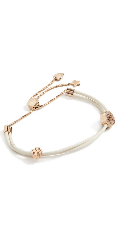 Shop Tory Burch Kira Pave Slider Bracelet In Tory Gold/new Ivory/crystal