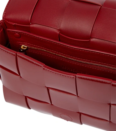 Shop Bottega Veneta Cassette Patent Leather Shoulder Bag In Dark Red-gold