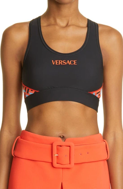Shop Versace La Greca Monogram Print Sports Bra In Black Orange