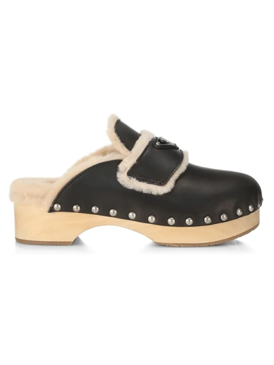 Shop Prada Shearling-lined Leather Clogs In Nero Sabbia