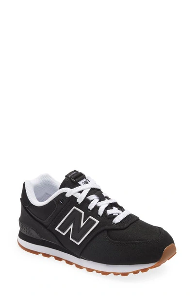 Shop New Balance 574 Sneaker In Black/ Black/ Black