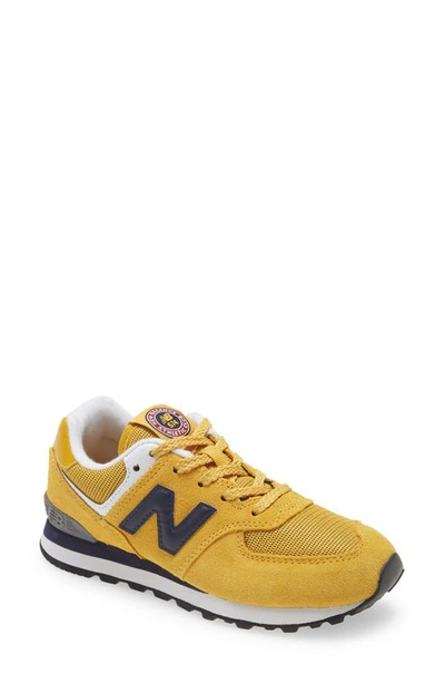 Shop New Balance 574 Sneaker In Varsity Gold