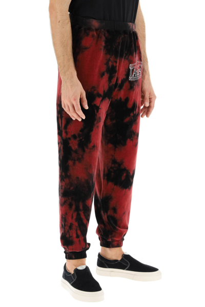 Shop Aries Rhinestone Logo Velour Sweatpants In Red,black