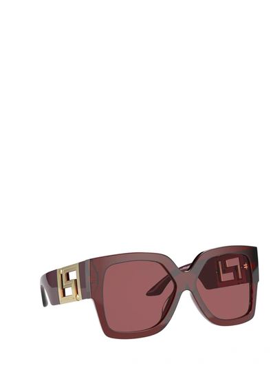 Shop Versace Eyewear Sunglasses In Transparent Red