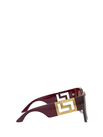 Shop Versace Eyewear Sunglasses In Transparent Red