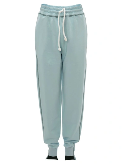 Shop Jw Anderson Tapered Contrast-stitch Joggers In Baby Blue