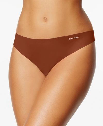 Shop Calvin Klein Women's Invisibles Thong Underwear D3428 In Cinnamon (nude )