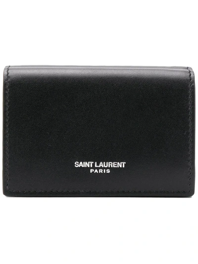 Shop Saint Laurent Logo Embossed Tiny Wallet In Black