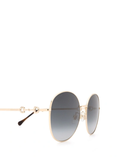 Shop Gucci Eyewear Sunglasses In Gold