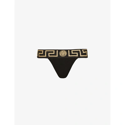 Shop Versace Greca-border Mid-rise Stretch-cotton Jersey Thong In A1008 Black