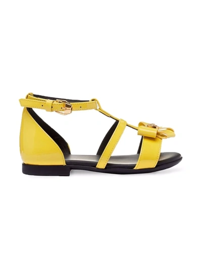 Shop Versace Bow-detail Sandals In Yellow