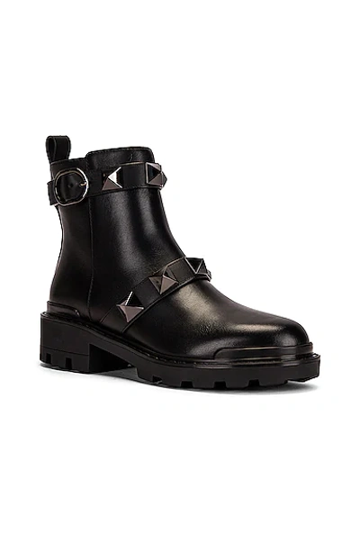 Shop Valentino Short Roman Stud Boots In Nero