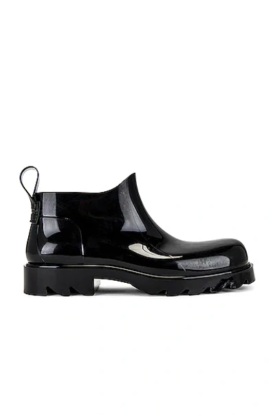 Shop Bottega Veneta Shiny Rubber Boot In Black