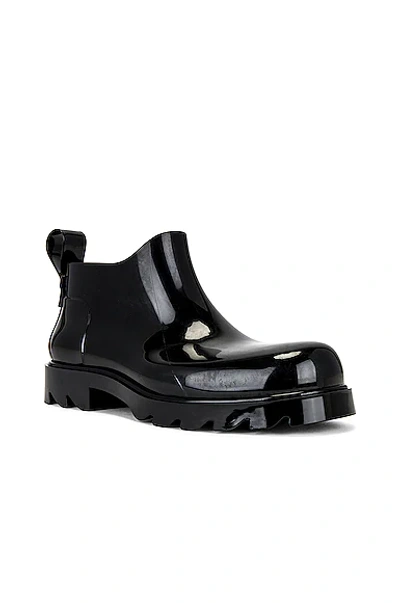 Shop Bottega Veneta Shiny Rubber Boot In Black