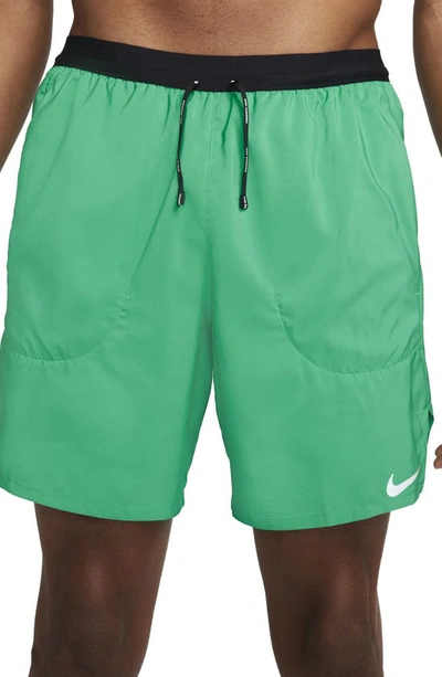 Shop Nike Flex Stride Performance Athletic Shorts In Roma Green/ Roma Green
