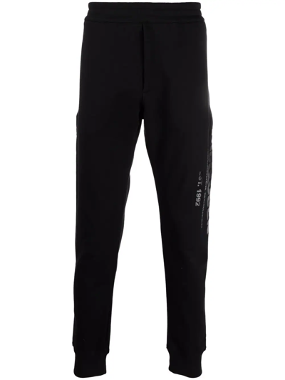 Shop Alexander Mcqueen Logo-print Cotton Track Trousers In 黑色