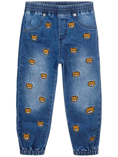 Shop Moschino Allover Teddy Bear Jeans In Blue