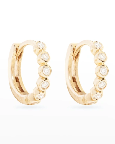 Shop Stone And Strand Bezel Diamond Huggie Earrings In Gold
