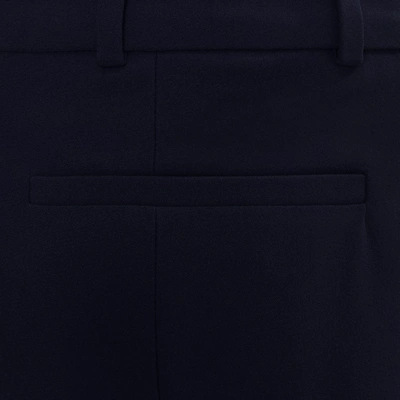 Shop Alexander Mcqueen Narrow Bootcut Trousers In Blue - Navy