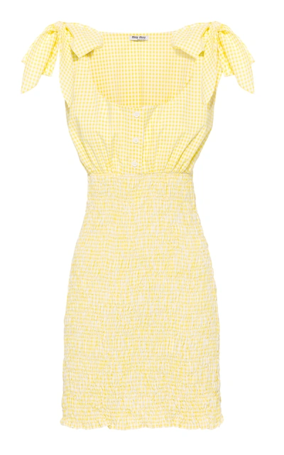 Shop Miu Miu Smocked Checked Cotton Mini Dress In Yellow