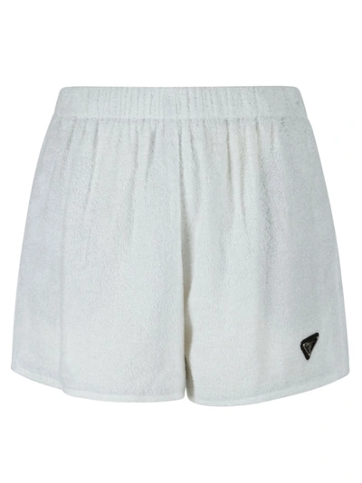 Shop Prada Embossed Logo Shorts In White