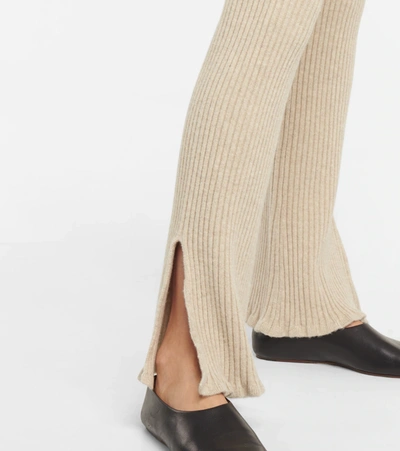 Shop Victoria Beckham Ribbed-knit Wool-blend Flared Pants In Off White Melange