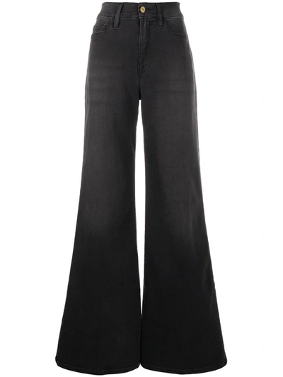 Shop Frame Faded Flared Jeans In Black