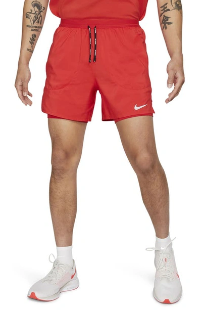 Shop Nike Dri-fit Flex Stride Pocket 2-in-1 Running Shorts In University Red/ University Red