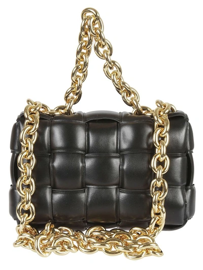 Shop Bottega Veneta Chain Cassette Shoulder Bag In Black Gold