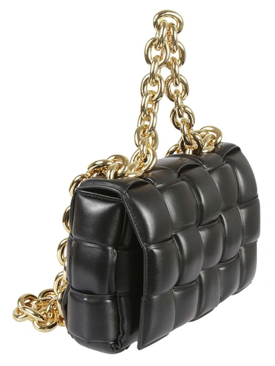Shop Bottega Veneta Chain Cassette Shoulder Bag In Black Gold