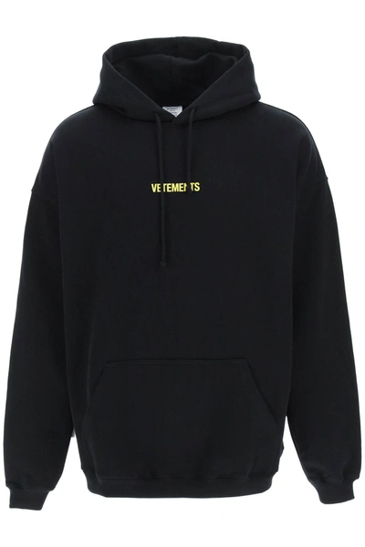 Shop Vetements Logo Label Maxi Hoodie In Black Neon Yellow (black)