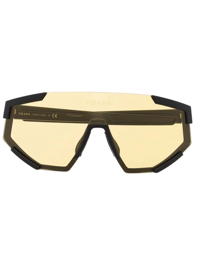 Shop Prada Tinted Visor Sunglasses In Schwarz