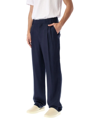 Shop Fear Of God Double Pleated Tapered Trousers In Navy