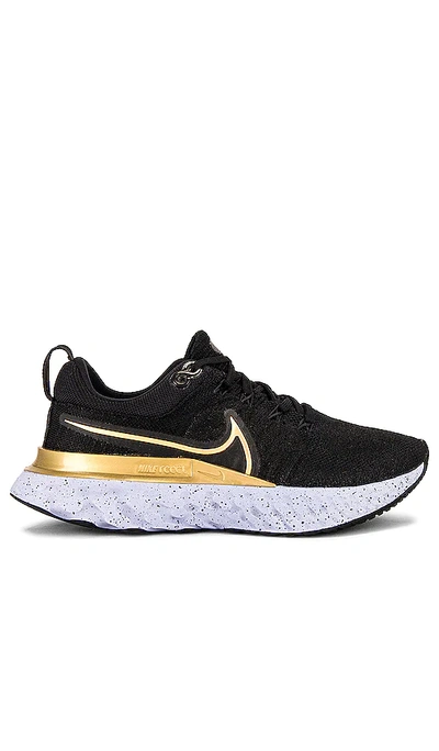 Shop Nike React Infinity Run Flyknit 2 Sneaker In Black  Metallic Gold  Ghost  & Dark Smok