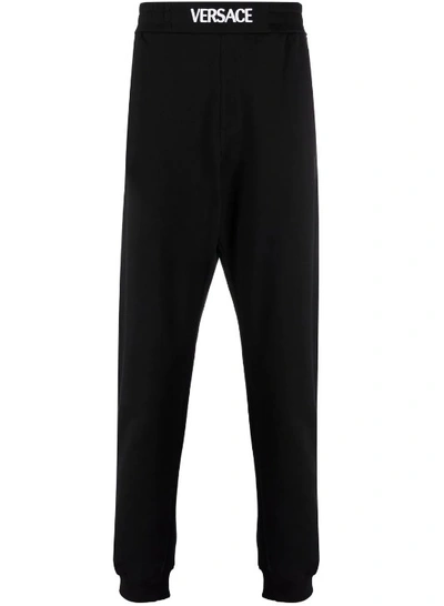 Shop Versace Black Logo-waistband Jersey Track Pants